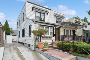 Come see this rare find in Bayside, 2 story semi detached Treasureland Duplex with a NEW 4 car privately owned driveway and huge detached garage in the Auburndale neighborhood.