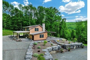 Private 61 Acre Retreat Custom Contemporary Home Escape to this serene 61 acre property, reached by a private bridge and featuring a custom 3 bed, 2 bath contemporary home.