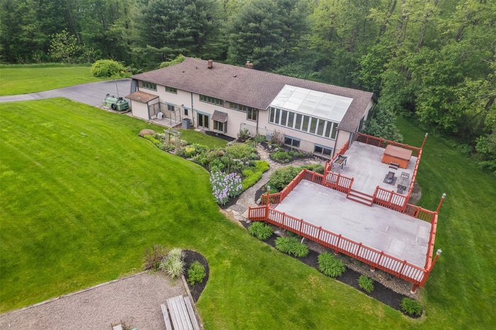 View from above of property with a forest