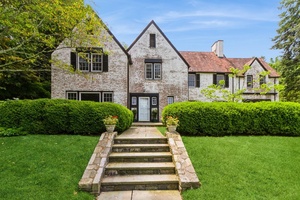 50 Overlook Drive, an elegant 6 bedroom colonial Tudor set in a quiet, tree lined neighborhood.