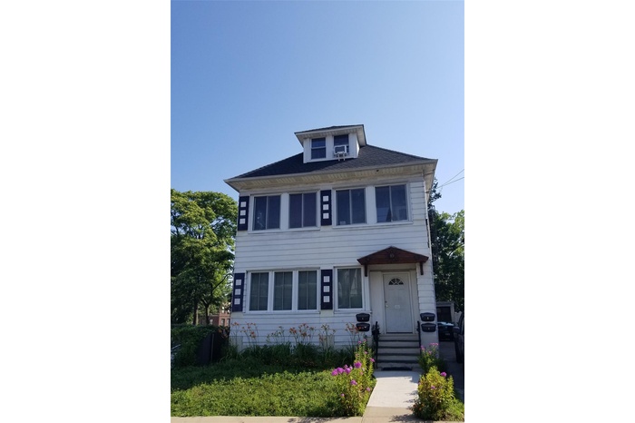 Traditional style home featuring entry steps