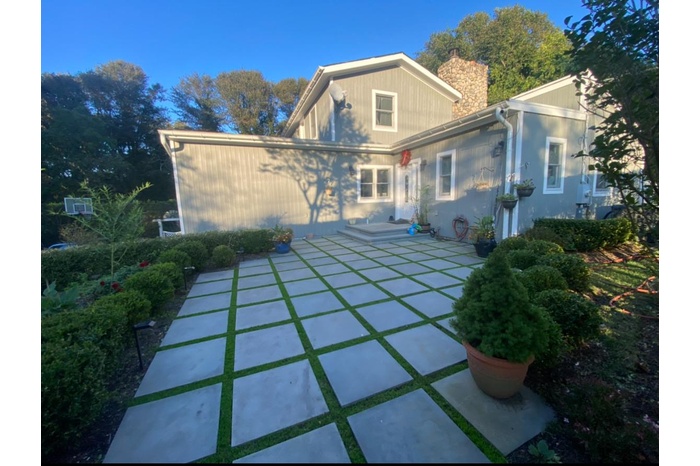 Back of house with a patio and a chimney