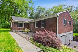 Welcome to this beautifully updated 3 bedroom, 2 bathroom brick ranch, nestled within a private lake community and set on nearly 3 acres of serene, landscaped grounds with mature plantings.