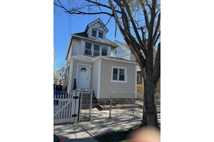 Detached 2 family property with newly renovated interior with hardwood floors, new kitchen, new bathrooms with new cabinets and granite countertops.