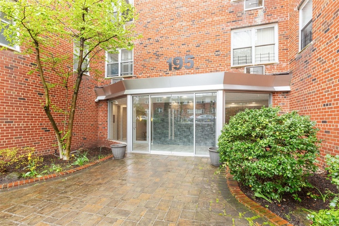 Property entrance with brick siding