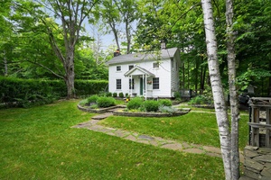 This classic 1890s farmhouse marries period charm with high end modern amenities in a natural setting.