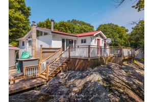 Set on 1. 4 acres in the Long Lake subdivision, this two bedroom home features a spacious floor plan with pine lined walls, cathedral ceilings, and hardwood floors throughout.