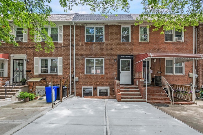 View of front facade featuring brick siding