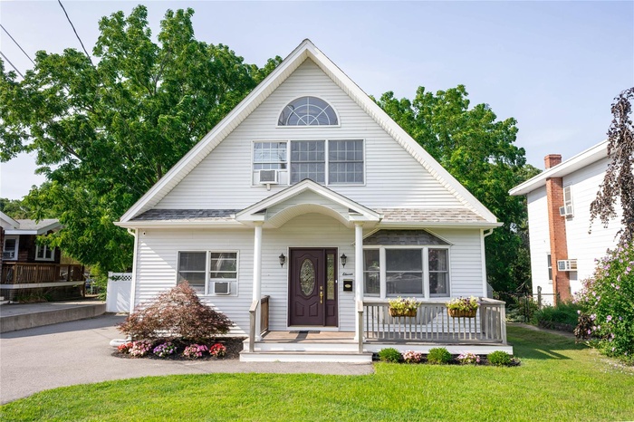 View of front of property with a front lawn