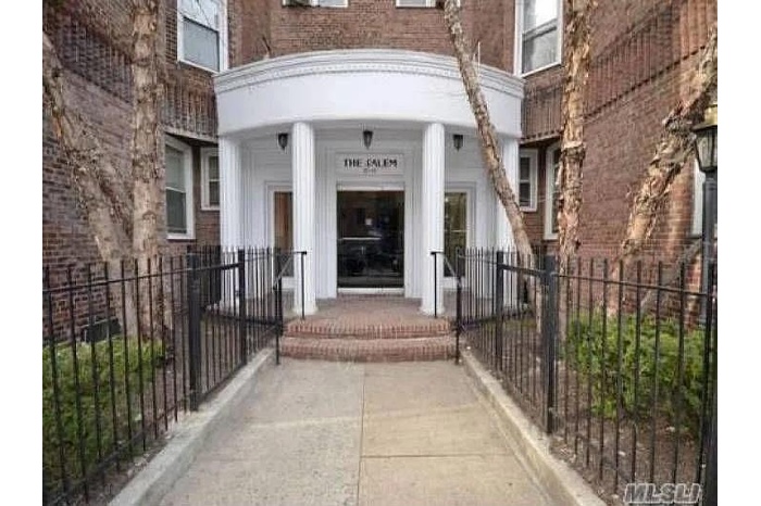 Doorway to property with brick siding