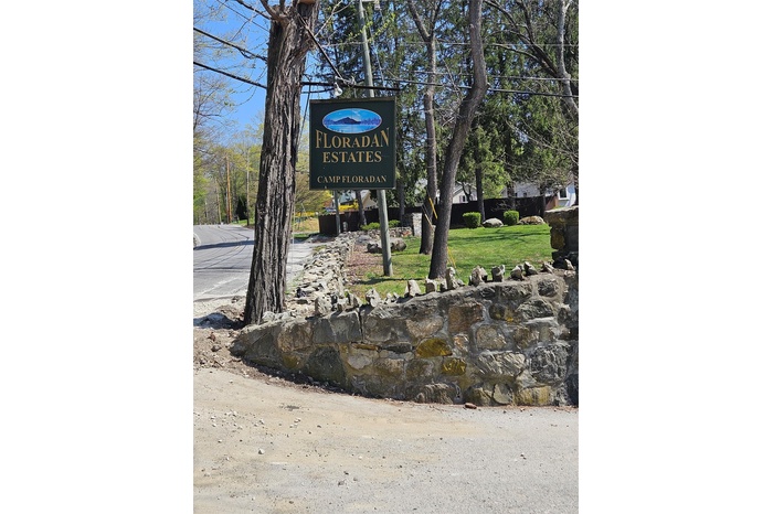 Community sign with a yard