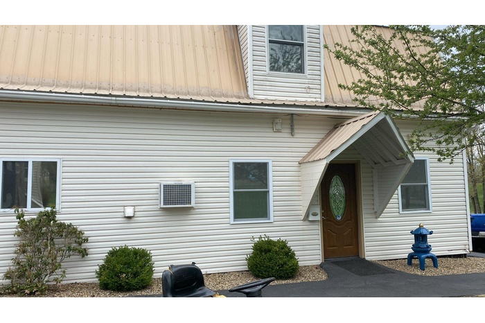 Property entrance with metal roof