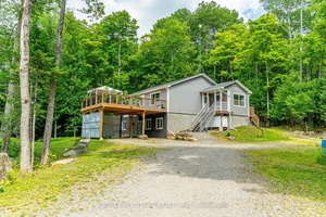 Tucked away on a quiet township road just 10 minutes form Haliburton, this well maintained raised bungalow offers the perfect mix of comfort, privacy, and outdoor adventure.