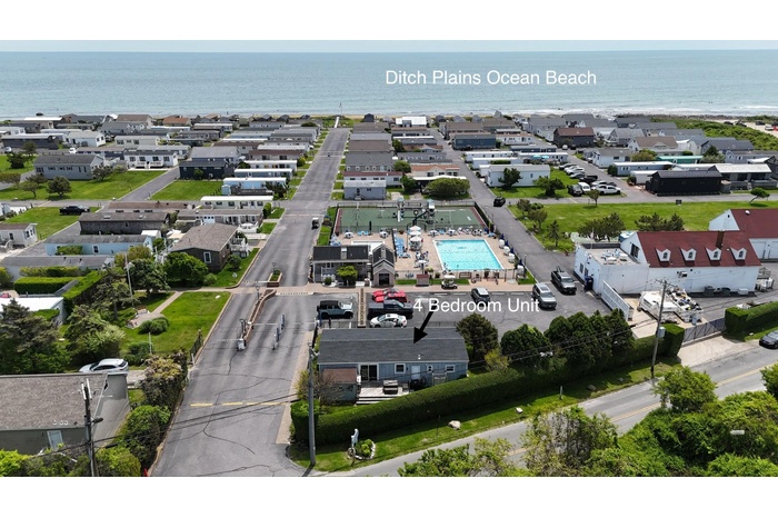 Aerial view of a nearby body of water and a pool area