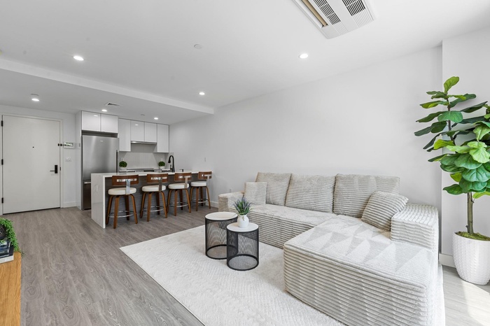 Living room featuring light wood-style floors and recessed lighting