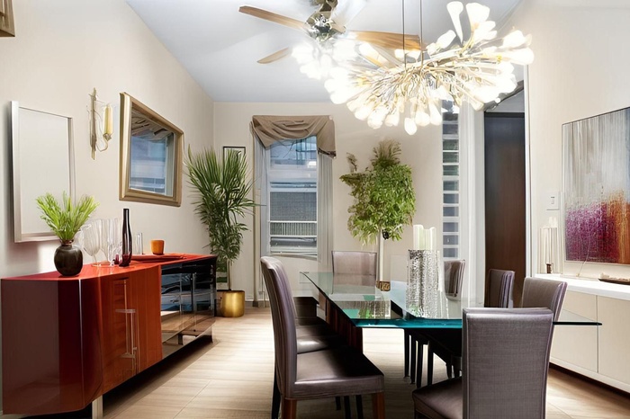 Dining space with a chandelier and ceiling fan