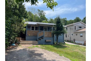 Sitting on a back lot to Crowe Lake this home is larger than it appears with 4 generous sized bedrooms, a 4 pc bath and 2 pc Ensuite.