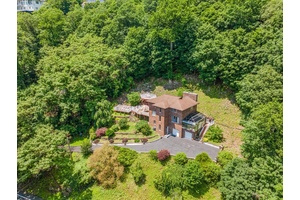 One of a kind river view retreat in prestigious Upper Grandview !