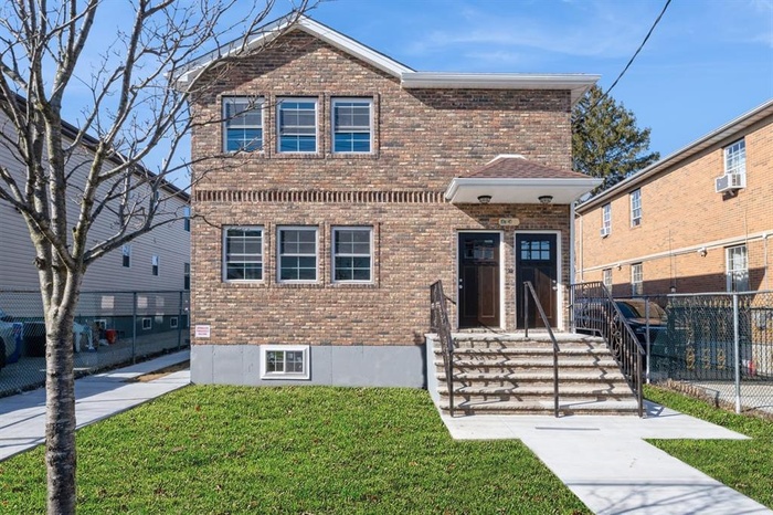 Traditional home with brick siding