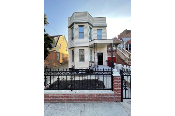 View of front of home with a fenced front yard