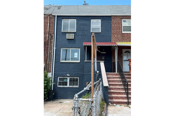 Traditional home featuring brick siding