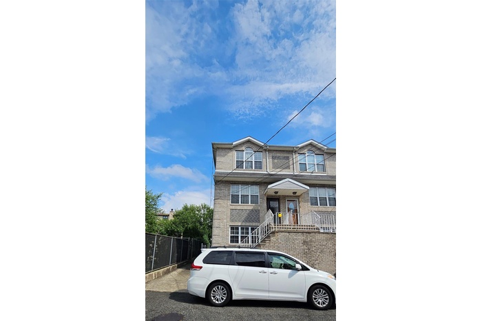 View of front facade featuring brick siding