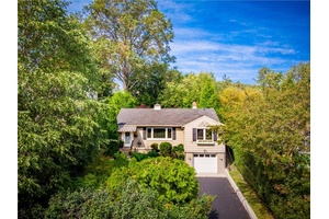 Imagine a Zen retreat with distant river views, set back from the road in a peaceful and picturesque Nyack neighborhood.