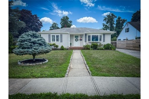Charming Cottage tucked away on a quiet dead end street just steps away from downtown Riverhead.