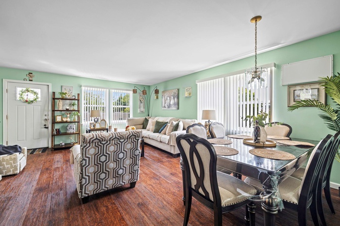 Dining space with dark wood-style floors