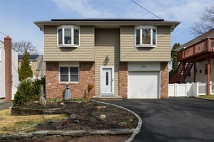 Welcome To This Bright And Inviting 5 Bedroom Home Situated In The Heart Of Bayville !
