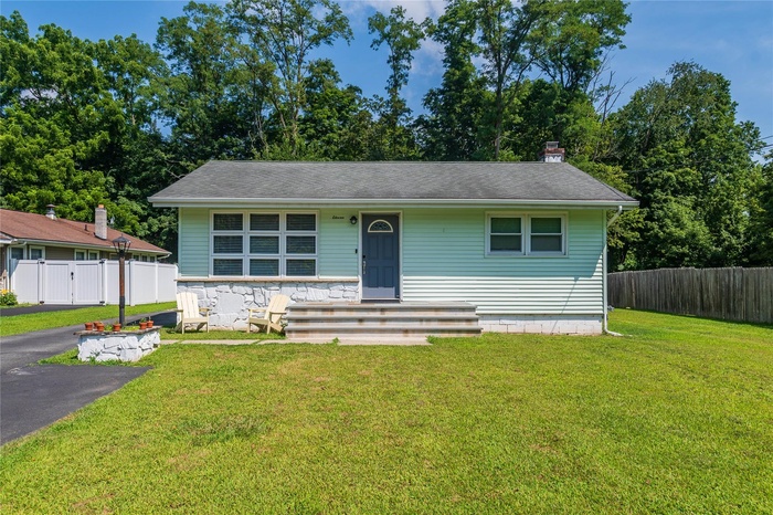 View of front of home featuring a chimney