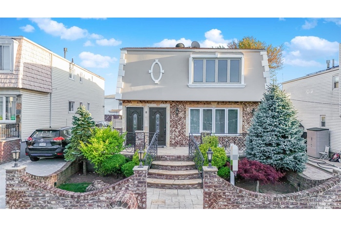 View of front of property featuring stucco siding