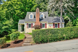 Welcome to this charming Cape Cod gem, perfectly situated in a serene neighborhood that seamlessly blends tranquility with convenience.