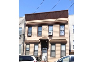 4 Family home ; all 4 apartments consist of 2 bedrooms and 1 full bath each.