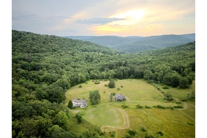 Step back in time and embrace the peaceful rhythms of country living with this extraordinary 1900s farmhouse, gracefully situated on a sprawling 250 acre estate.