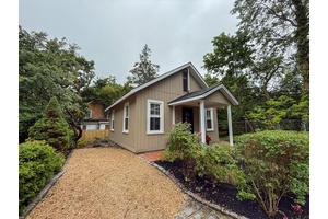 This beautifully appointed Sea Cliff bungalow offers a cozy yet airy retreat, brimming with character and thoughtful updates.