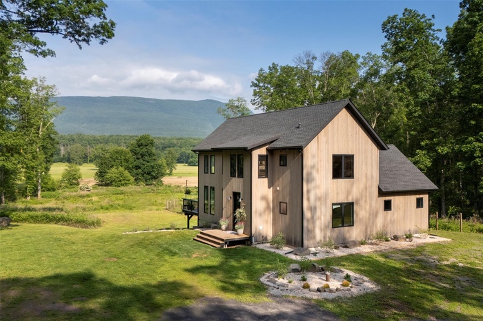 View of outbuilding with a mountain view