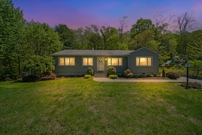 View of front of house at sundown