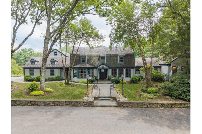 Colonial inspired home with a front yard