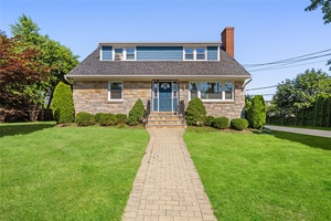 Nestled on a level, oversized corner lot, this beautifully updated 2 family home offers exceptional value and versatility in the heart of West Harrison.
