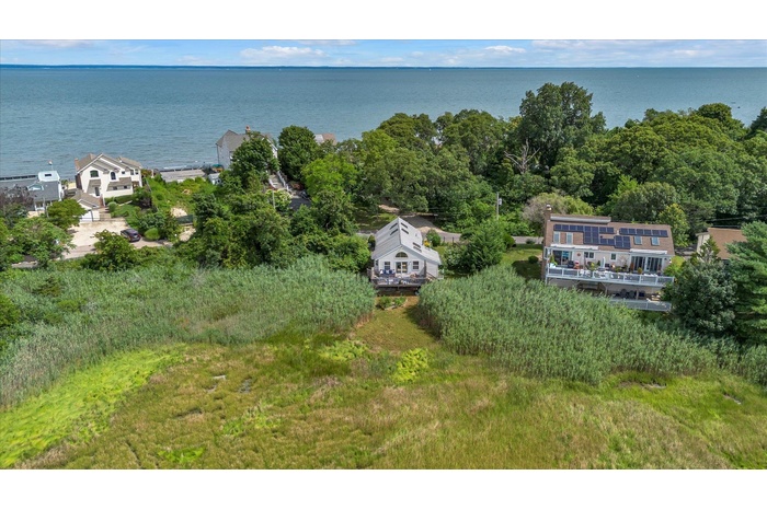 View from above of property with a nearby body of water