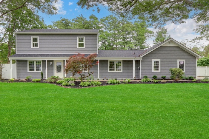 View of front of house with a shingled roof