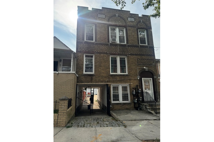 View of front of house with brick siding