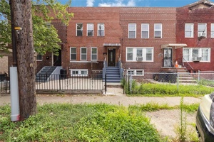 Welcome to this beautifully renovated brick move in ready attached 1 family home on a quiet block in prime Jamaica location.