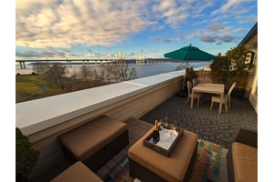 Welcome to 153 West Main Street, an exceptional waterfront residence nestled within the coveted Hudson Harbor community.