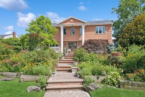 Stately 7 Bedroom, 7 Bath Brick Estate with Water Views in Prime Woodsburgh Location.
