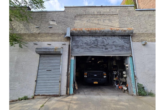 Garage with concrete driveway