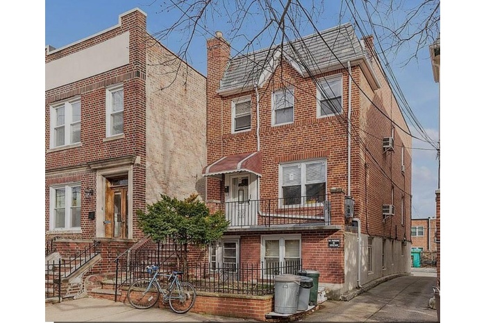 View of front of property featuring brick siding