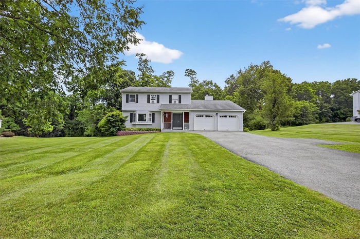 Finally for sale in Bristol Woods! A beautiful colonial on one acre with a two tiered deck and a pool!
