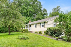 Step into the serene embrace of this charming Ranch style home, where comfort meets tranquility on a private one acre haven.